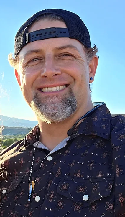 Corbin, owner and lead technician of Utah Heritage HVAC, smiling outdoors in Southern Utah